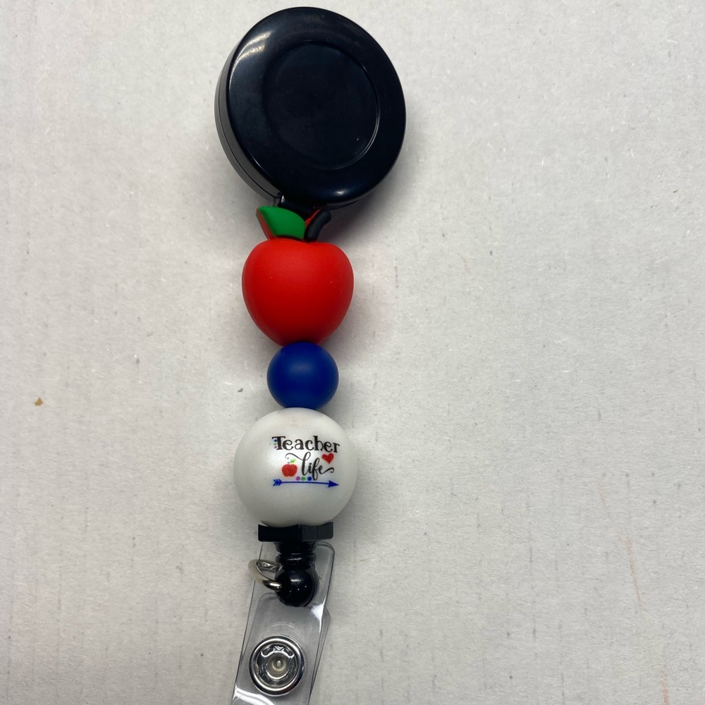 NWT TEACHER BADGE REEL
